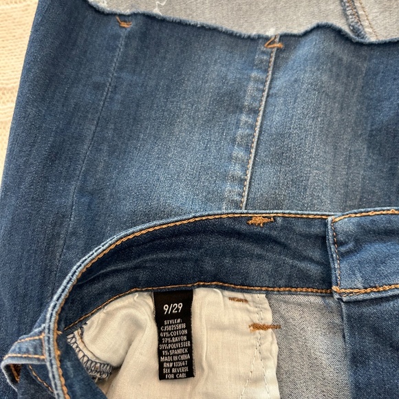 Denim skirt with fringe hem would be adorable with leggings. - Picture 2 of 3